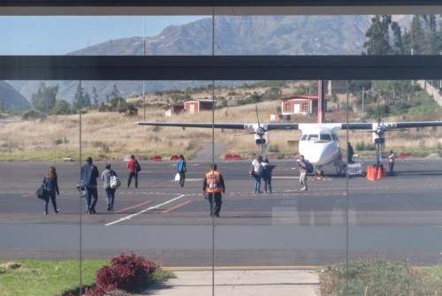 Becca walking out to board the little flight from Huaraz to get a flight home from Lima