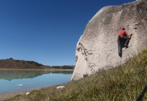 Bouldering on his own at Lago Keushu